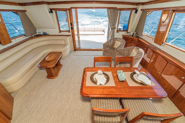 Slide: The Image of Luxurious interior of 2008 Navigator 62 Pilothouse yacht with elegant dining and seating area. - 25