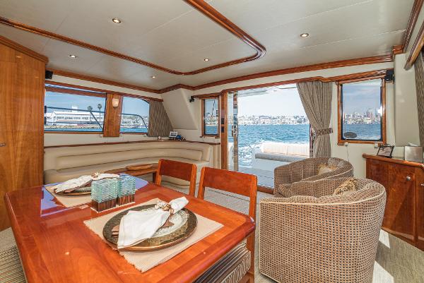 Slide: The Image of Luxurious interior of 2008 Navigator 62 Pilothouse yacht with elegant dining area and waterfront view. - 27