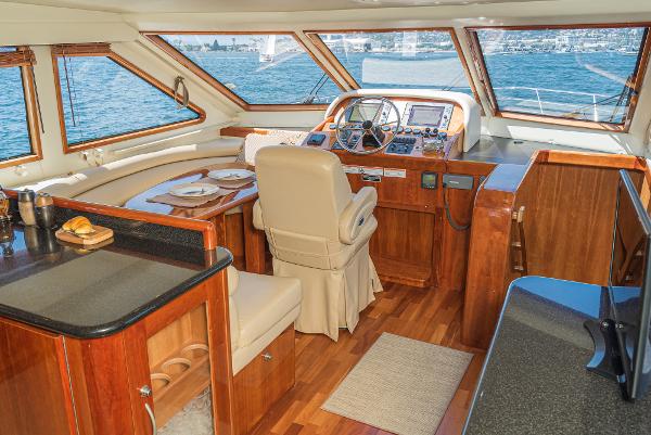 Slide: The Image of Luxurious 2008 Navigator 62 Pilothouse interior with elegant wood finish and panoramic windows. - 37