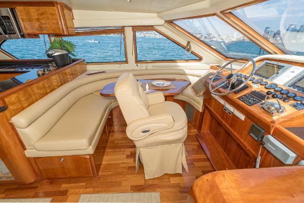 Slide: The Image of Luxurious interior of 2008 Navigator 62 Pilothouse yacht with leather seating and wooden finishes. - 39