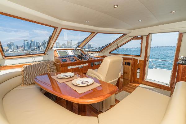 Slide: The Image of Luxurious 2008 Navigator 62 Pilothouse interior with city skyline view through large windows. - 40