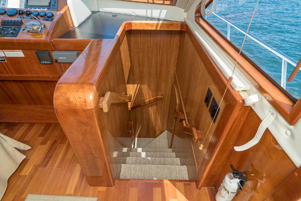 Slide: The Image of Interior staircase of 2008 Navigator 62 Pilothouse yacht with wooden finish. - 42