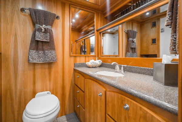 Slide: The Image of Luxurious bathroom in 2008 Navigator 62 Pilothouse yacht with wood cabinetry and modern fixtures. - 45