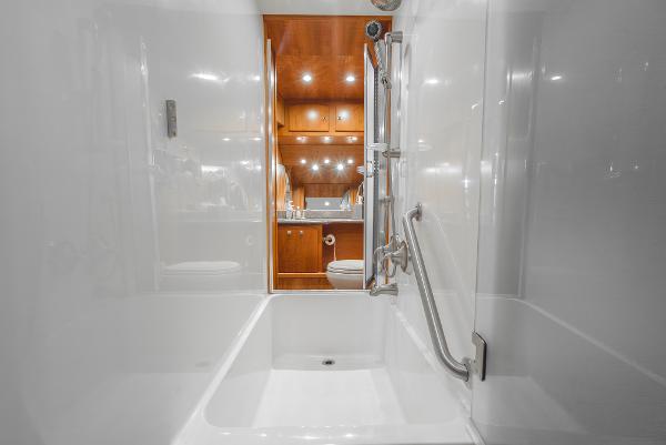 Slide: The Image of Luxurious bathroom interior of 2008 Navigator 62 Pilothouse yacht, featuring modern fixtures and wood accents. - 46