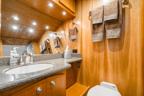 Slide: The Image of Luxurious bathroom in 2008 Navigator 62 Pilothouse yacht with wood paneling and modern fixtures. - 48
