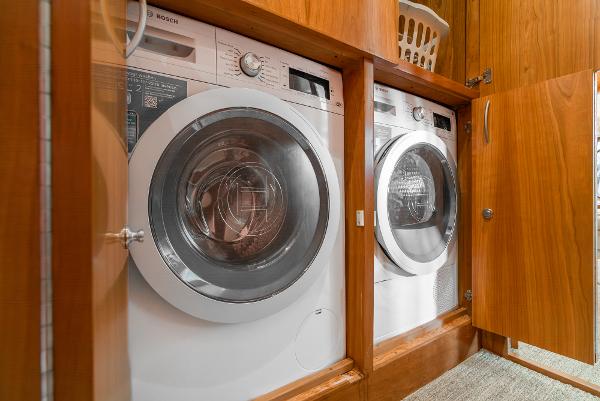 Slide: The Image of Laundry area with Bosch washer and dryer in 2008 Navigator 62 Pilothouse yacht. - 49