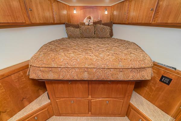 Slide: The Image of Luxurious bedroom in 2008 Navigator 62 Pilothouse yacht with elegant bedding and wood cabinetry. - 50