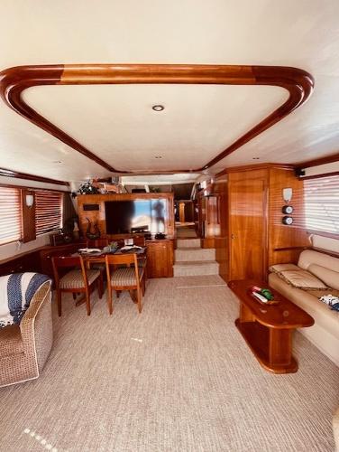 Slide: The Image of Luxurious 2008 Navigator 62 Pilothouse interior with elegant wood finishes and cozy seating. - 7