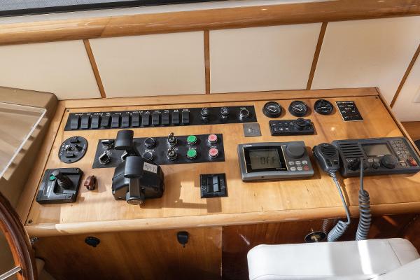 Slide: The Image of Control Panel Conveniently Beside Helm - 13