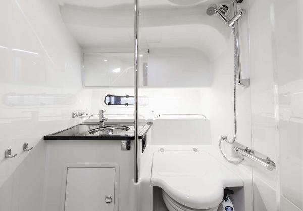 Slide: The Image of Modern bathroom in 2025 Nimbus 305 Coupe with sleek fixtures and white interior. - 10