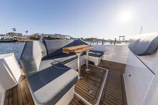 Slide: The Image of Nimbus T9 2025 boat with spacious seating and wooden deck. - 2