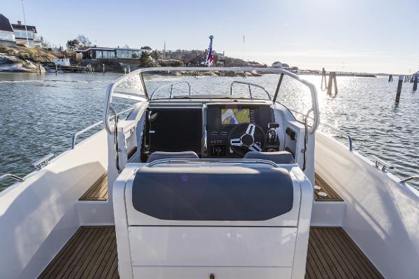Slide: The Image of 2025 Nimbus T9 boat cockpit with navigation system on a sunny day. - 4