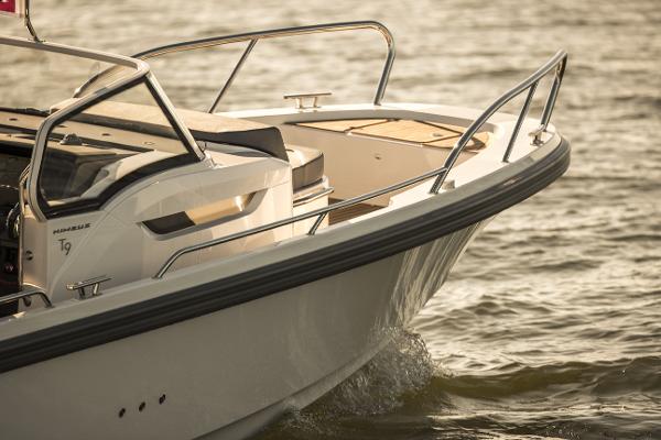 Slide: The Image of 2025 Nimbus T9 boat cruising on water. - 9