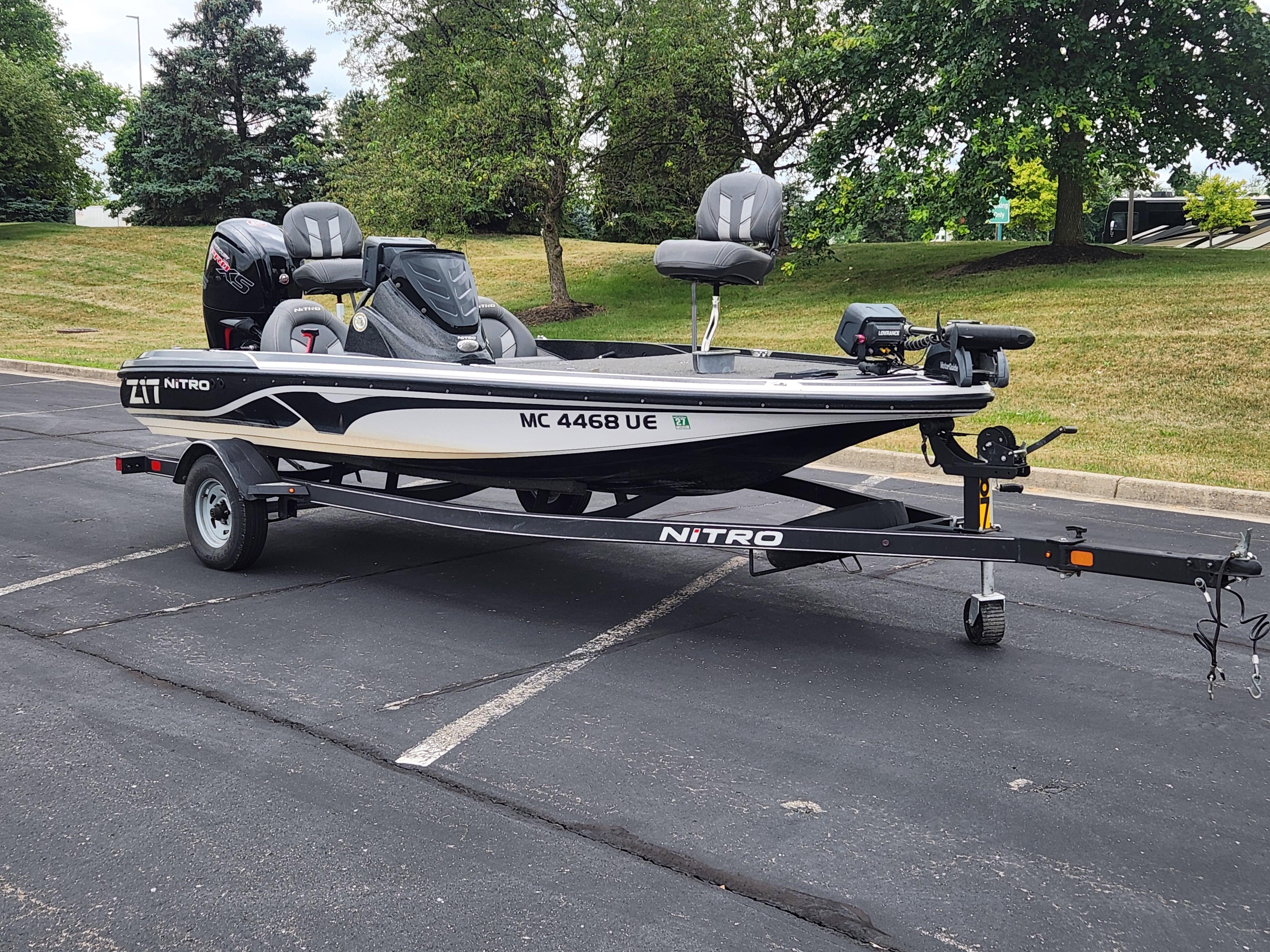 Slide: The Image of 2017 Nitro Z17 fishing boat on trailer in parking lot. - 0