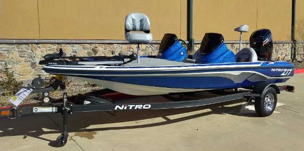 Slide: The Image of 2024 Nitro Z17 fishing boat on trailer, blue and white design. - 0