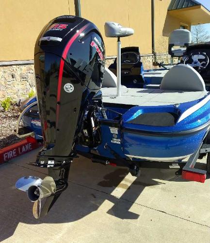 Slide: The Image of 2024 Nitro Z17 boat with powerful outboard motor, blue exterior, parked on concrete. - 6
