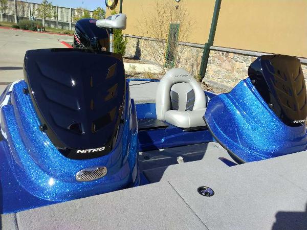 Slide: The Image of 2024 Nitro Z17 boat with blue metallic finish and dual consoles. - 7