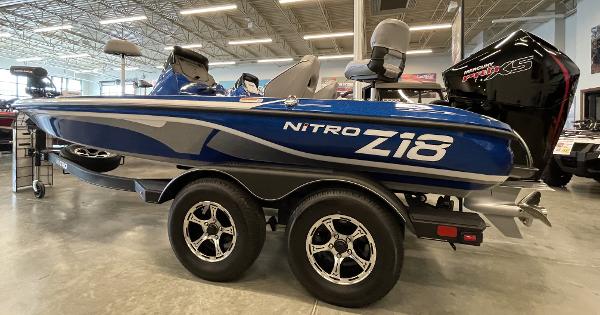 Slide: The Image of 2024 Nitro Z18 bass boat in showroom, side view. - 0
