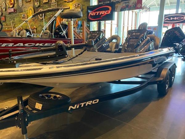 Slide: The Image of 2024 Nitro Z18 boat displayed in a showroom. - 1