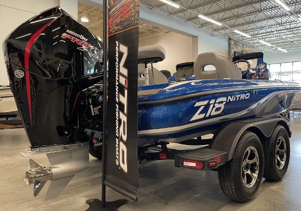 Slide: The Image of 2024 Nitro Z18 boat with Mercury Pro XS engine in showroom. - 1