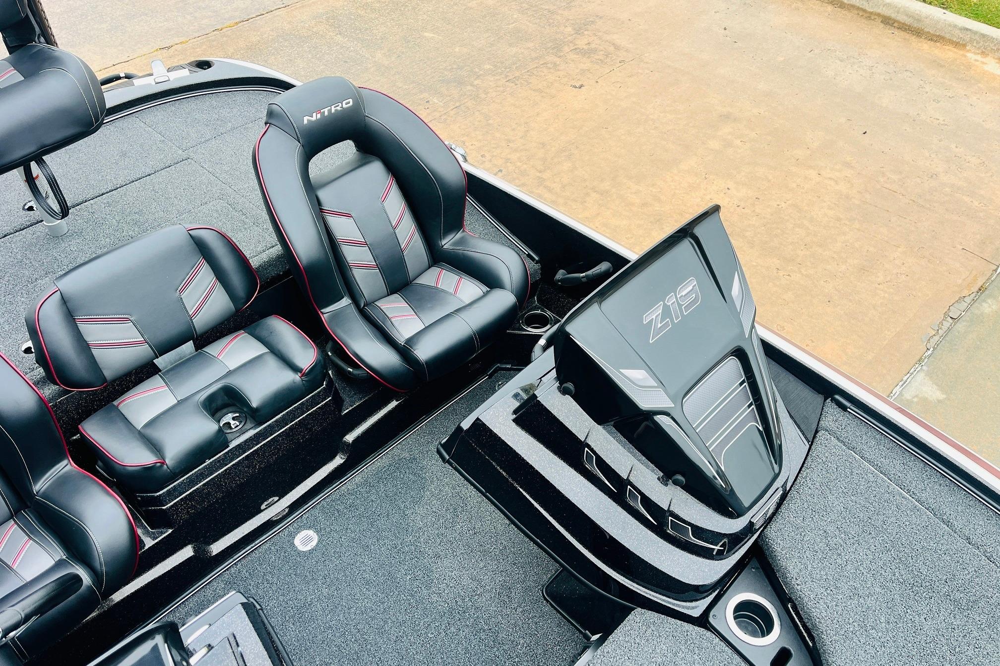 Slide: The Image of 2021 Nitro Z19 Pro boat interior with sleek black and red seating design. - 26