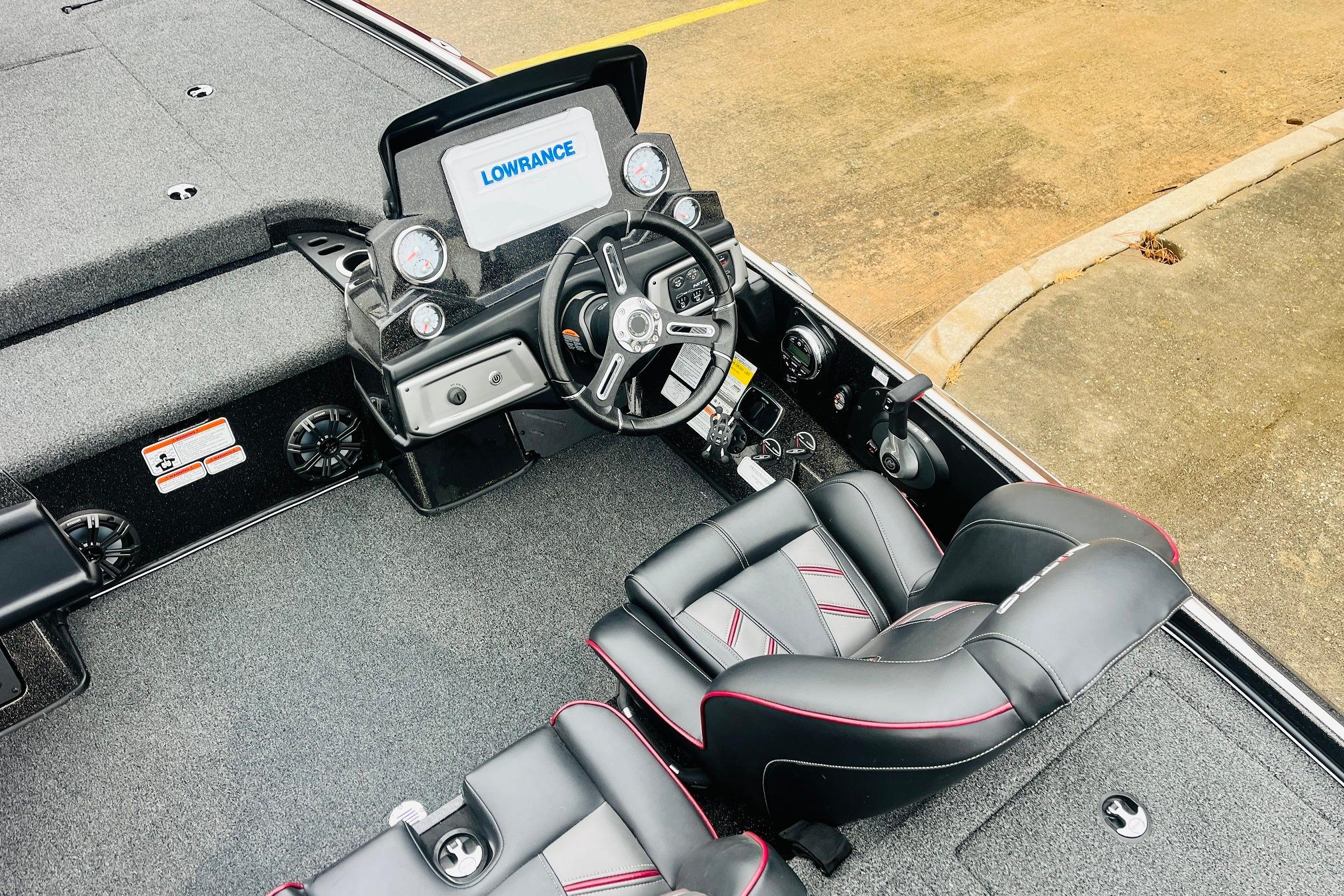 Slide: The Image of Nitro Z19 Pro 2021 boat interior with steering wheel and Lowrance display. - 34