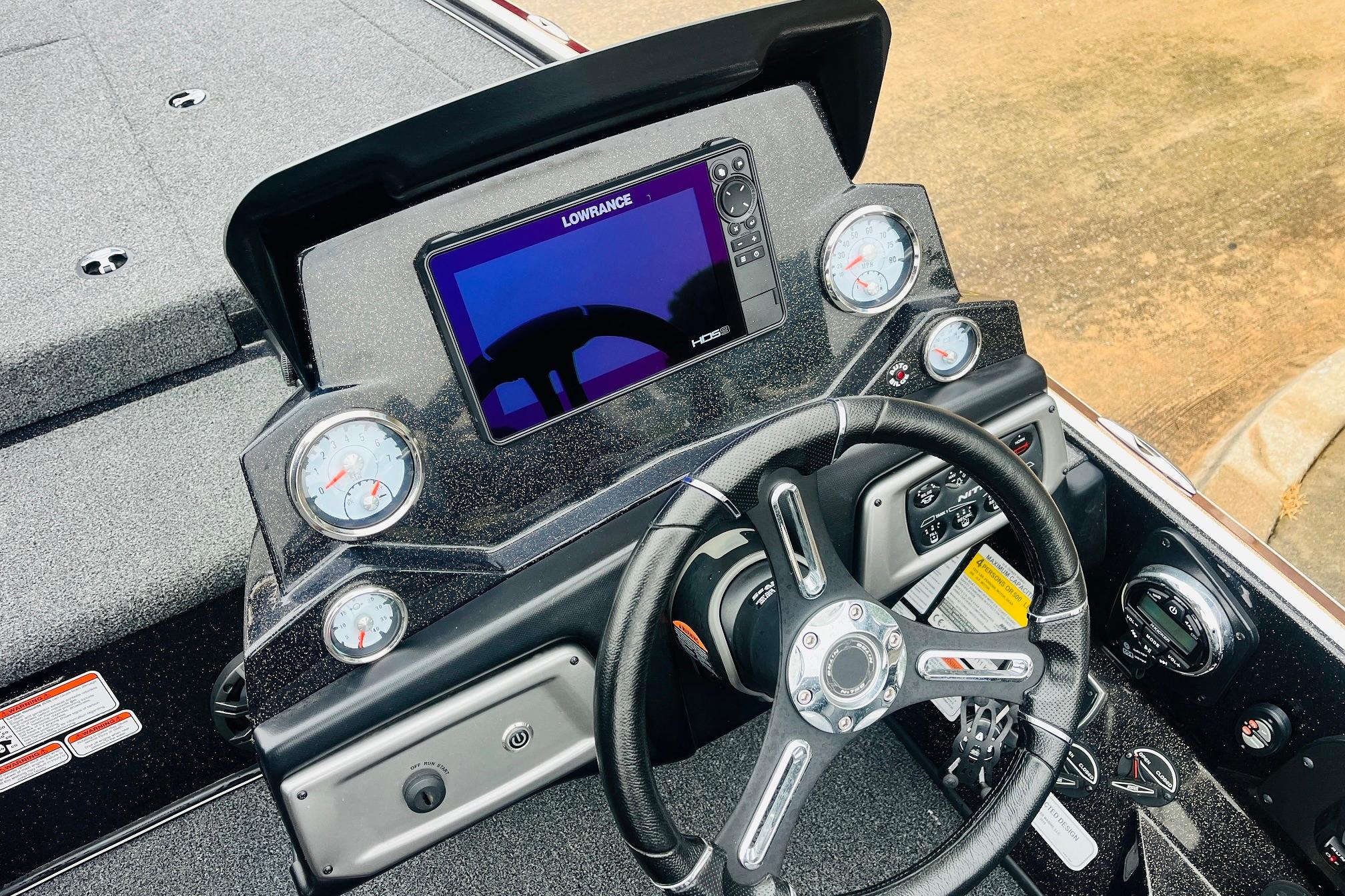 Slide: The Image of Dashboard of a 2021 Nitro Z19 Pro boat with steering wheel and digital display. - 36