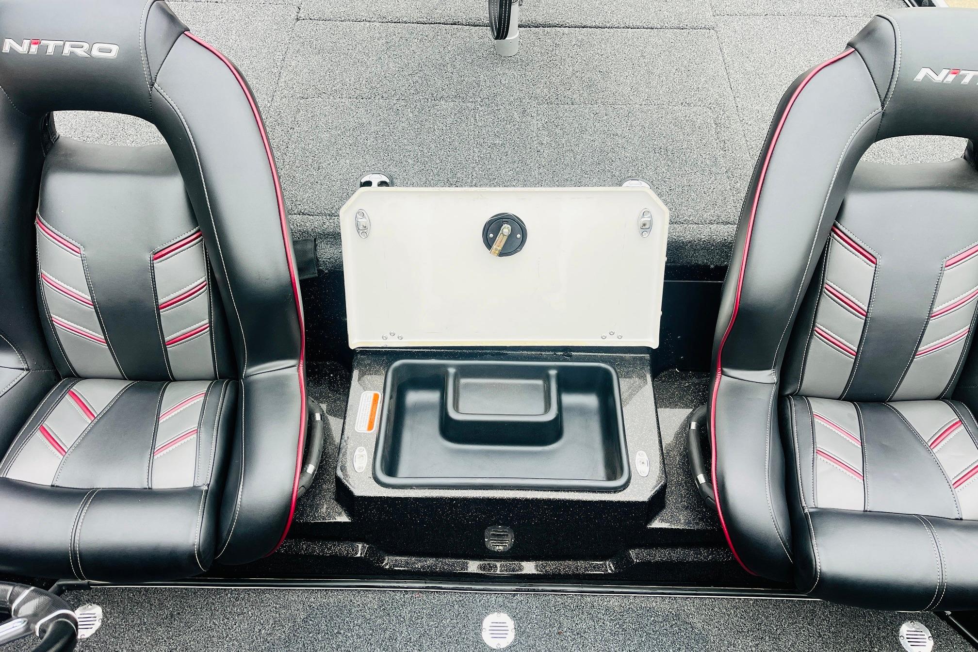 Slide: The Image of 2021 Nitro Z19 Pro boat interior with black and red seats and storage compartment. - 42