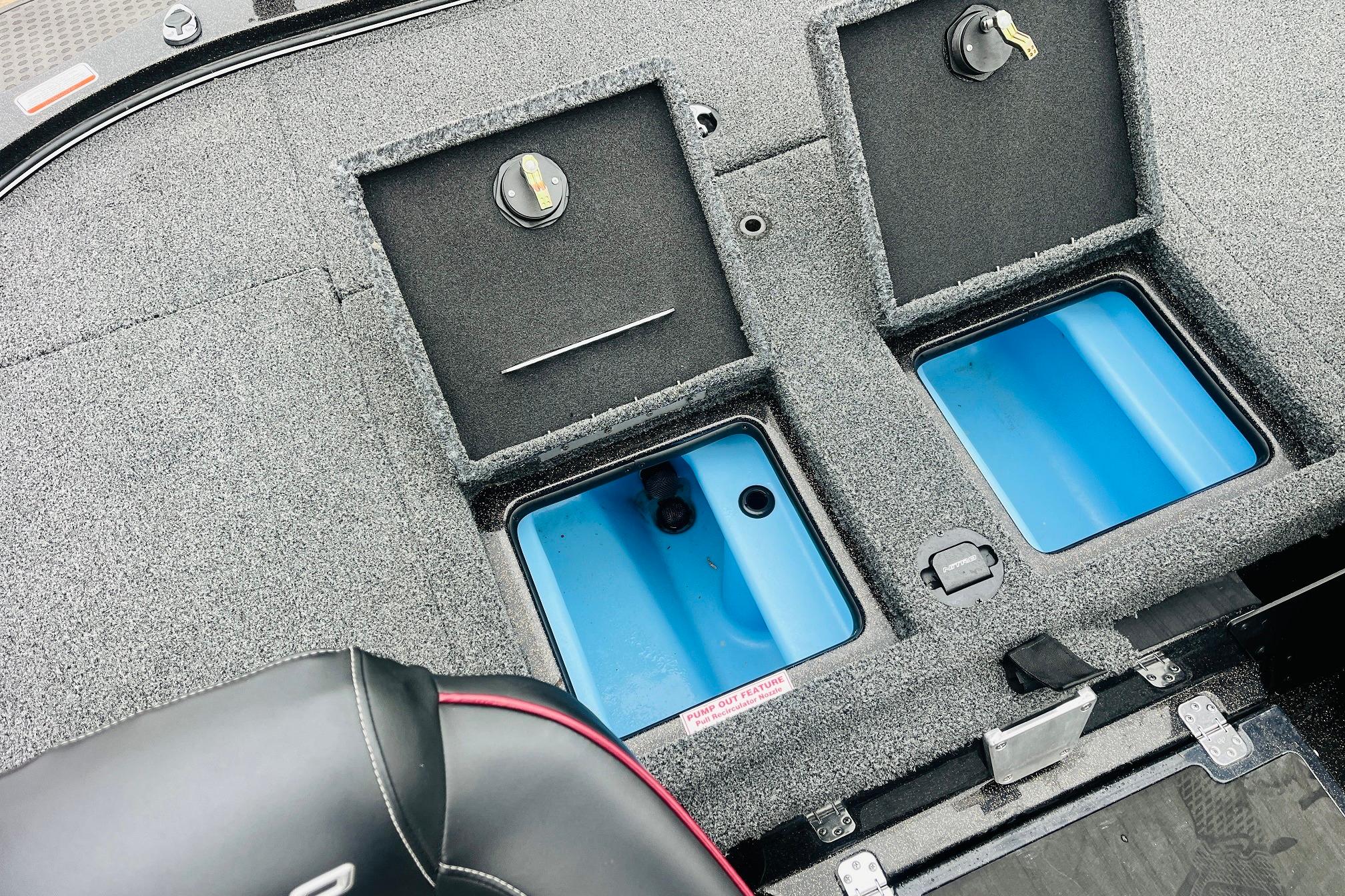 Slide: The Image of 2021 Nitro Z19 Pro boat storage compartments with blue interior and secure locks. - 46