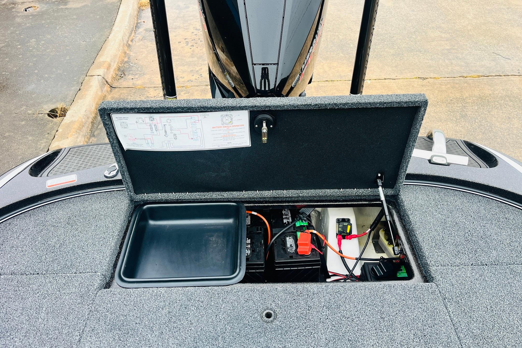 Slide: The Image of Open storage compartment of a 2021 Nitro Z19 Pro boat, revealing electrical components. - 53