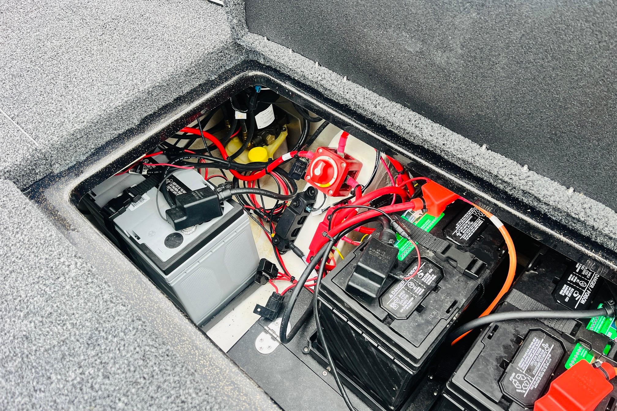 Slide: The Image of Battery compartment of 2021 Nitro Z19 Pro boat with wiring and components. - 55