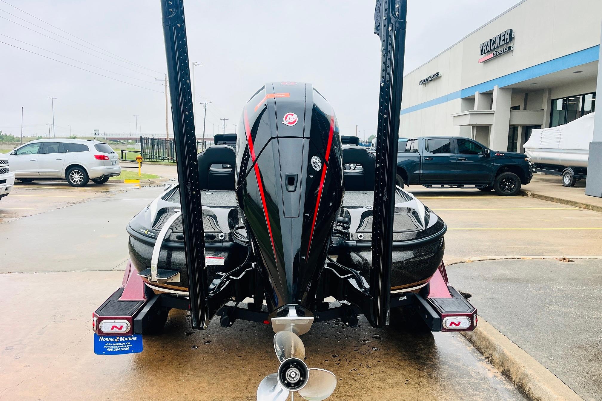 Slide: The Image of 2021 Nitro Z19 Pro boat with powerful outboard motor at dealership parking lot. - 6