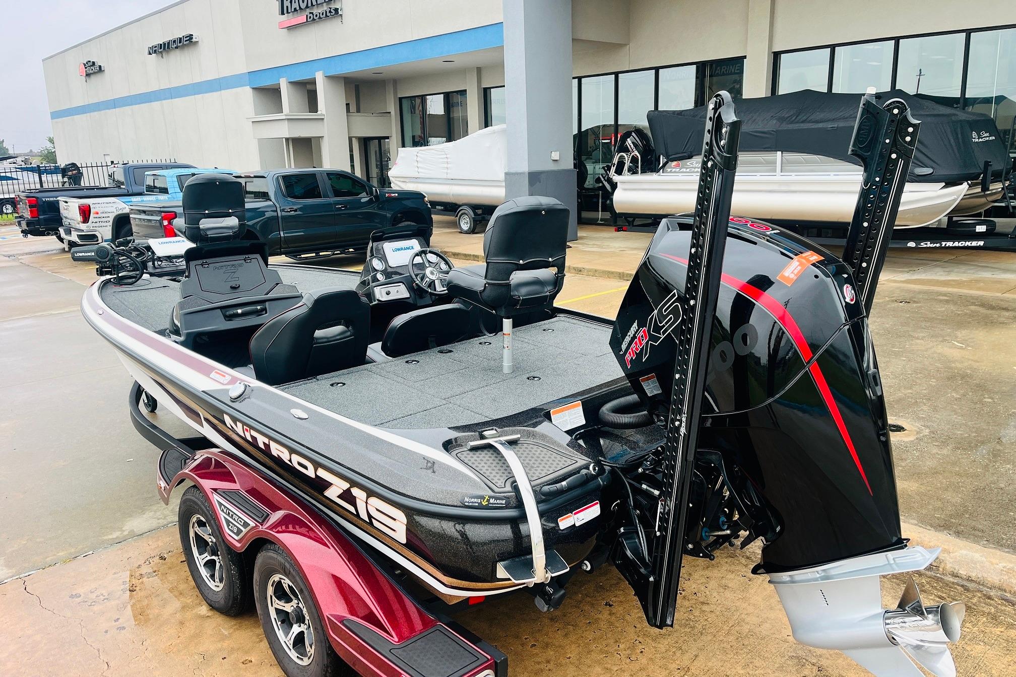 Slide: The Image of 2021 Nitro Z19 Pro boat with powerful engine, parked outside dealership. - 7
