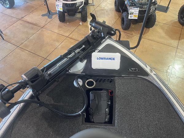 Slide: The Image of 2024 Nitro Z19 Pro boat with Lowrance electronics and trolling motor in showroom. - 11