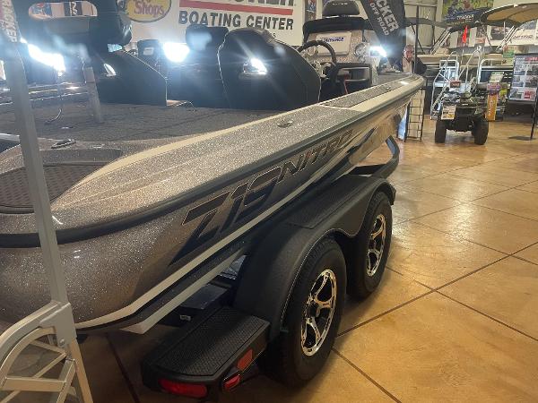 Slide: The Image of 2024 Nitro Z19 Pro boat on display in a showroom. - 5