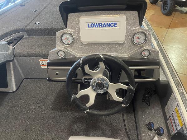 Slide: The Image of 2024 Nitro Z19 Pro boat dashboard with Lowrance display and steering wheel. - 9