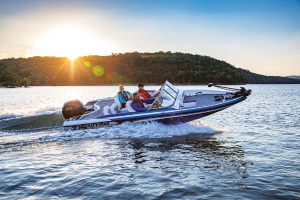 Slide: The Image of 2020 Nitro Z19 Sport boat cruising on a lake at sunset. - 20