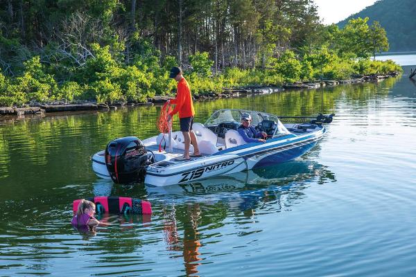Slide: The Image of 2020 Nitro Z19 Sport boat on a lake with people enjoying water activities. - 22