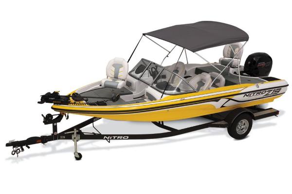 Slide: The Image of 2020 Nitro Z19 Sport boat, yellow with canopy, on trailer. - 28