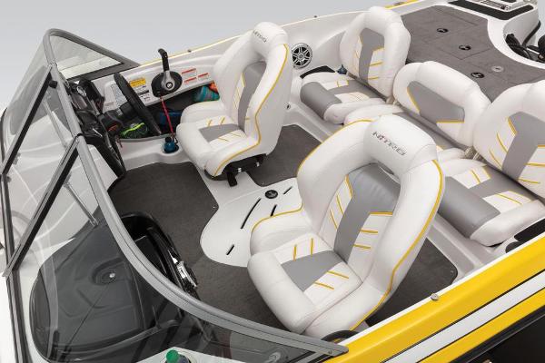Slide: The Image of 2020 Nitro Z19 Sport boat interior with white and gray seating, steering wheel, and dashboard. - 44