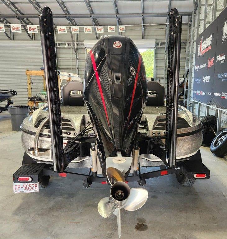 Slide: The Image of 2022 Nitro Z20 boat in garage, rear view with motor and propeller visible. - 1