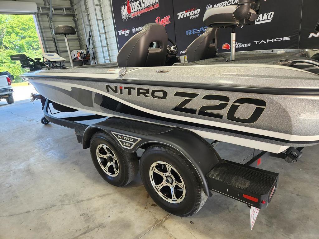 Slide: The Image of 2022 Nitro Z20 boat on trailer in garage, showcasing sleek design and branding. - 2
