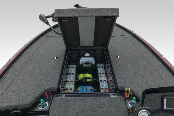 Slide: The Image of 2022 Nitro Z20 boat with open storage compartment and organized tackle boxes. - 8