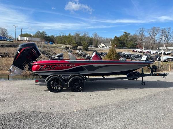 Slide: The Image of 2023 Nitro Z20 Pro boat on trailer, red and black, side view. - 1