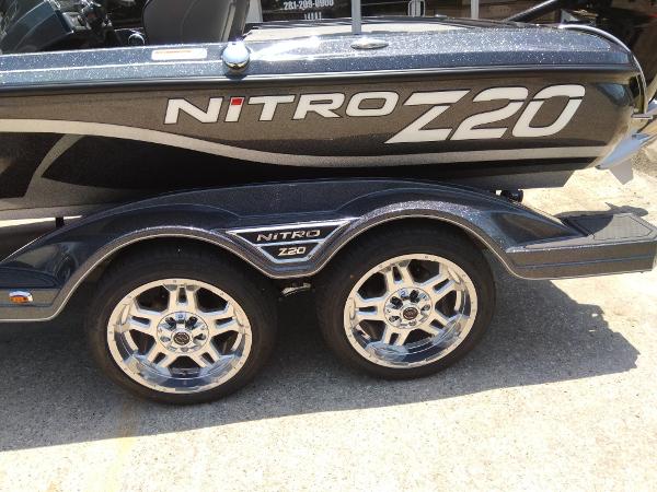 Slide: The Image of 2023 Nitro Z20 Pro boat with dual axle trailer and chrome wheels. - 7