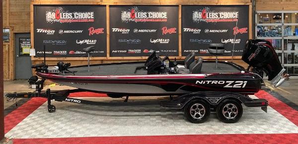 Slide: The Image of 2021 Nitro Z21 Pro bass boat on display with trailer. - 0