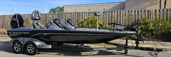 Slide: The Image of 2024 Nitro Z21 XL bass boat on a trailer. - 1