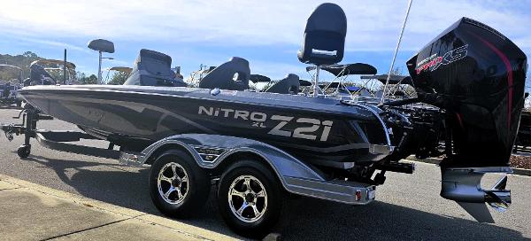 Slide: The Image of 2024 Nitro Z21 XL boat on trailer with powerful outboard motor. - 5