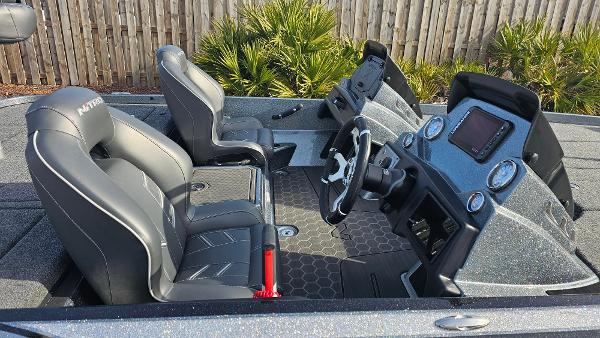 Slide: The Image of 2024 Nitro Z21 XL boat interior with dual seats and advanced dashboard. - 9