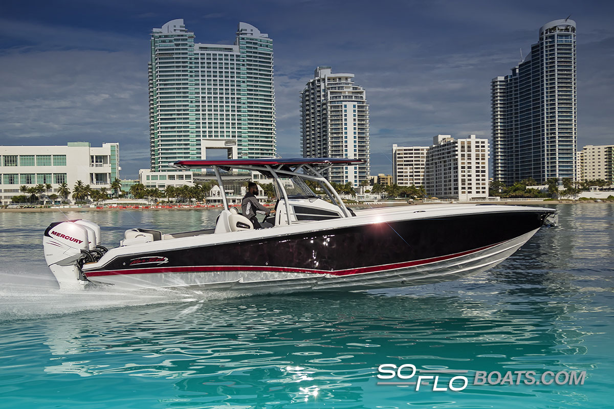 Slide: The Image of 2024 Nor-Tech 340 Sport Center Console boat cruising near city skyline. - 1